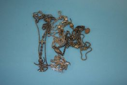 A quantity of silver and silver plated Alberts and a silver brooch