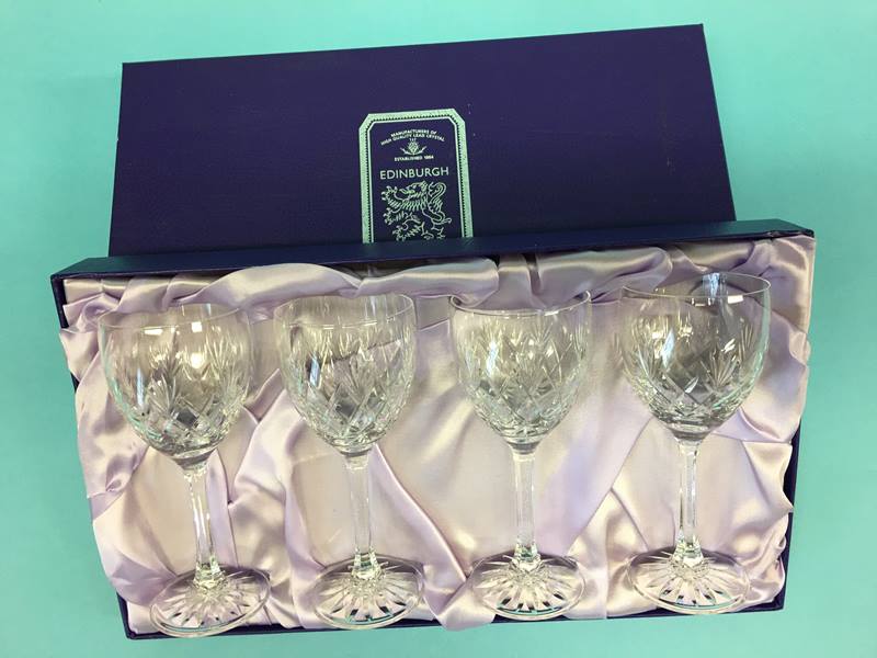 A boxed set of four Edinburgh Crystal wine glasses