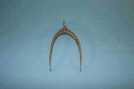 A pair of silver sugar nips in the shape of a wishbone, weight 15 grams