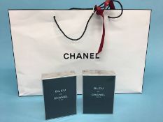 Two 'Bleu de Chanel Paris', 100ml bottles of eau de toilette (unused), with Chanel bags