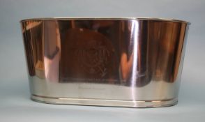 A large metal ice bucket, with impressed verse and crest