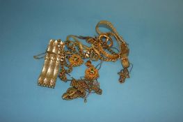 Four yellow metal necklaces, two bracelets and two pairs of earrings