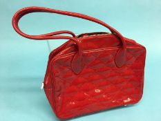 Red patent handbag from Lulu Guinness with red stitching