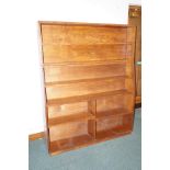 Solid oak bookcase in two sections with an array o