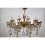 Brass Rococo style 8 branch chandelier with crysta