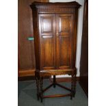 Oak corner cupboard, dental cornice over a reeded