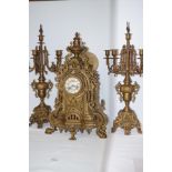 Gilt metal clock garniture, pierced case with circ