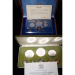 Singapore proof set of coins together with Trinida