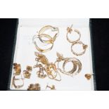 9 pairs of 9ct earrings Total weight 14.8 grams