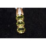 Peridot & diamond pendant with coa