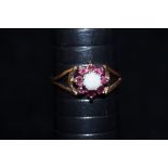 9 ct Gold dress ring set with ruby's & central opa