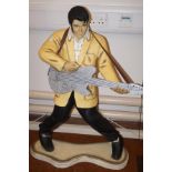 Large resin model of Elvis with a wooden guitar He