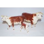 Beswick hereford trio (Repair to leg on one)