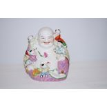 Smiling ceramic Buddha with children Height 24 cm