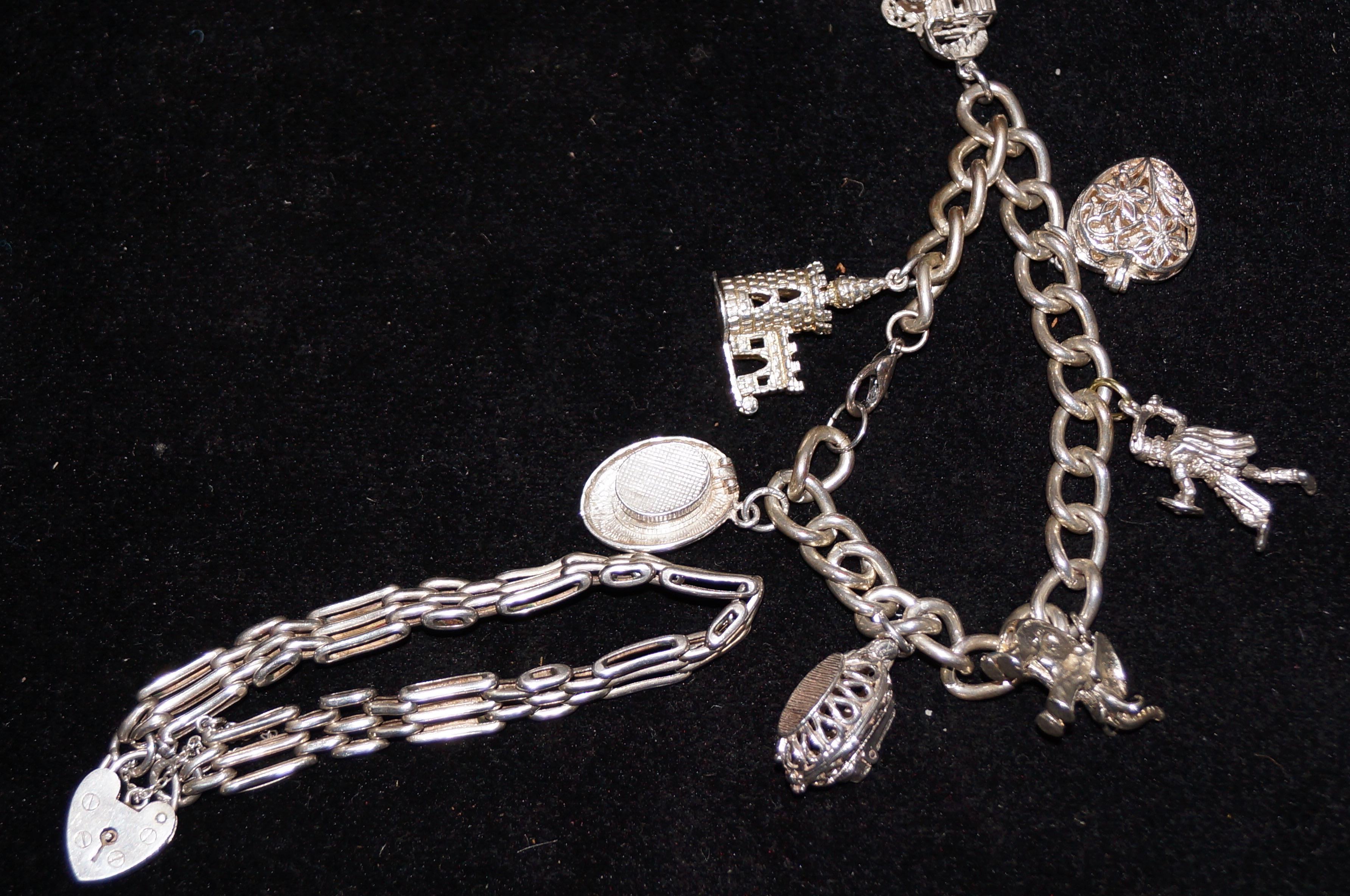 Silver charm bracelet with 7 charms together with