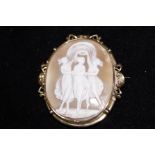 Yellow metal cameo brooch with the three graces