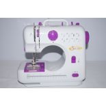 Small sewing machine with case