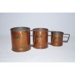 3 Graduating copper measuring jug