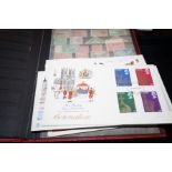 Stamp album together with first day covers