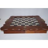 Carved wood chess board with full set of pieces in