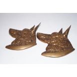 Pair of bronze wall plaques in the form of hounds