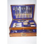 Part cutlery set in military style oak case