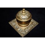 Early brass inkwell