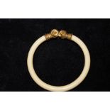 Ivory bangle with rams head terminals