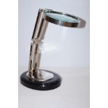 Large magnifying glass on wooden base height 31 cm