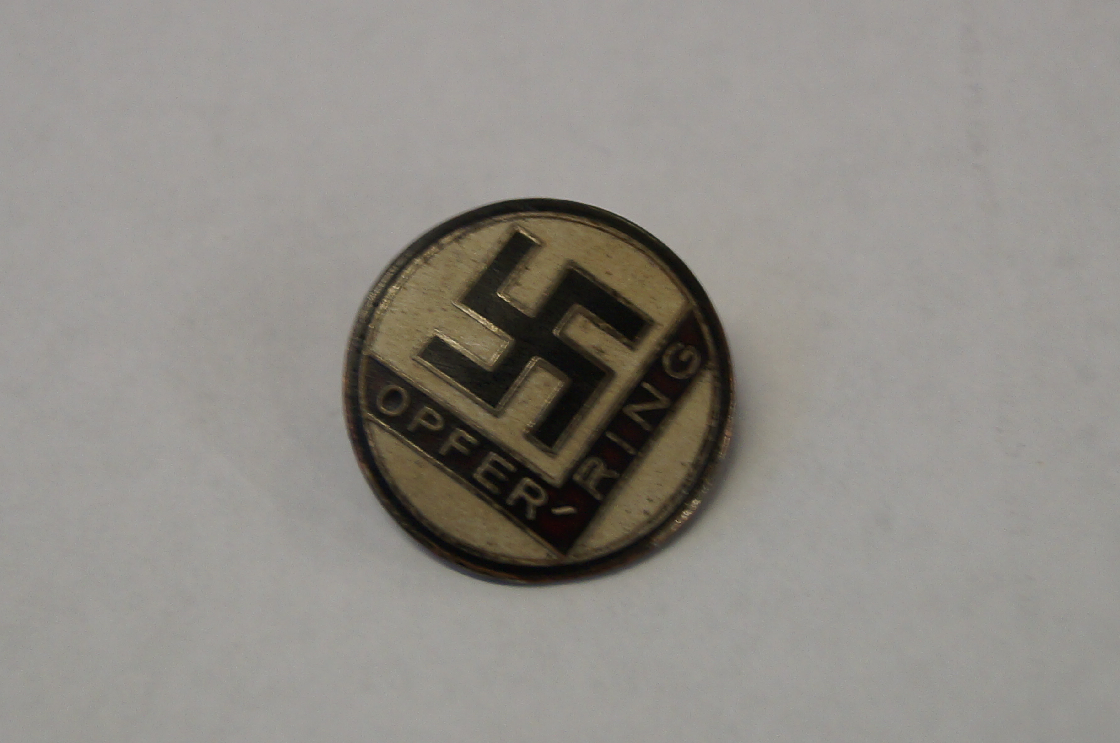 Enamel swastika badge