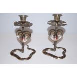 Pair of candle sticks/ashtrays in the form of hood