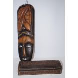 African wall mask with a Indian box