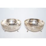 Pair or continental footed silver bowls with lion