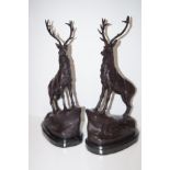 Pair of bronze stags on marble bases, height 44 cm