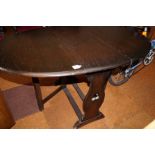 Solid oak drop leaf table with trefoil pierced end