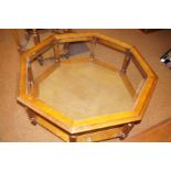 Octagonal glass topped coffee table