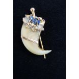 Yellow metal pin brooch set with blue stones teste