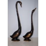 2 Patterned bronze swans Largest 57 cm