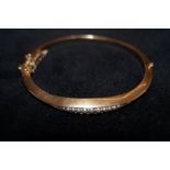 9ct gold bangle set with seed pearls with safety c
