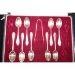 Part set of 9 silver tea spoons & sugar tongs in c