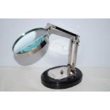 Magnifying glass on wooden base