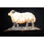 Cast iron door stop in the form of a ram