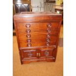 Chinese rosewood cabinet enclosing fitted interior