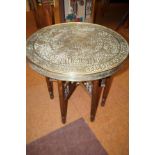 Eastern Islamic brass top side table with chased d