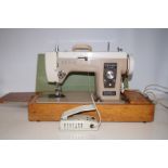 Cased new home electric treadle sewing machine (Te