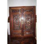 Chinese mirror with ornate reticulating doors