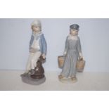 2 Lladro figures of boys Largest 24 cm