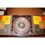 Old wooden roulette wheel with fitted box. Wheel d