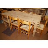 Pine dining table with 8 rush seated chairs