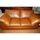 Very good quality brown leather two seater settee